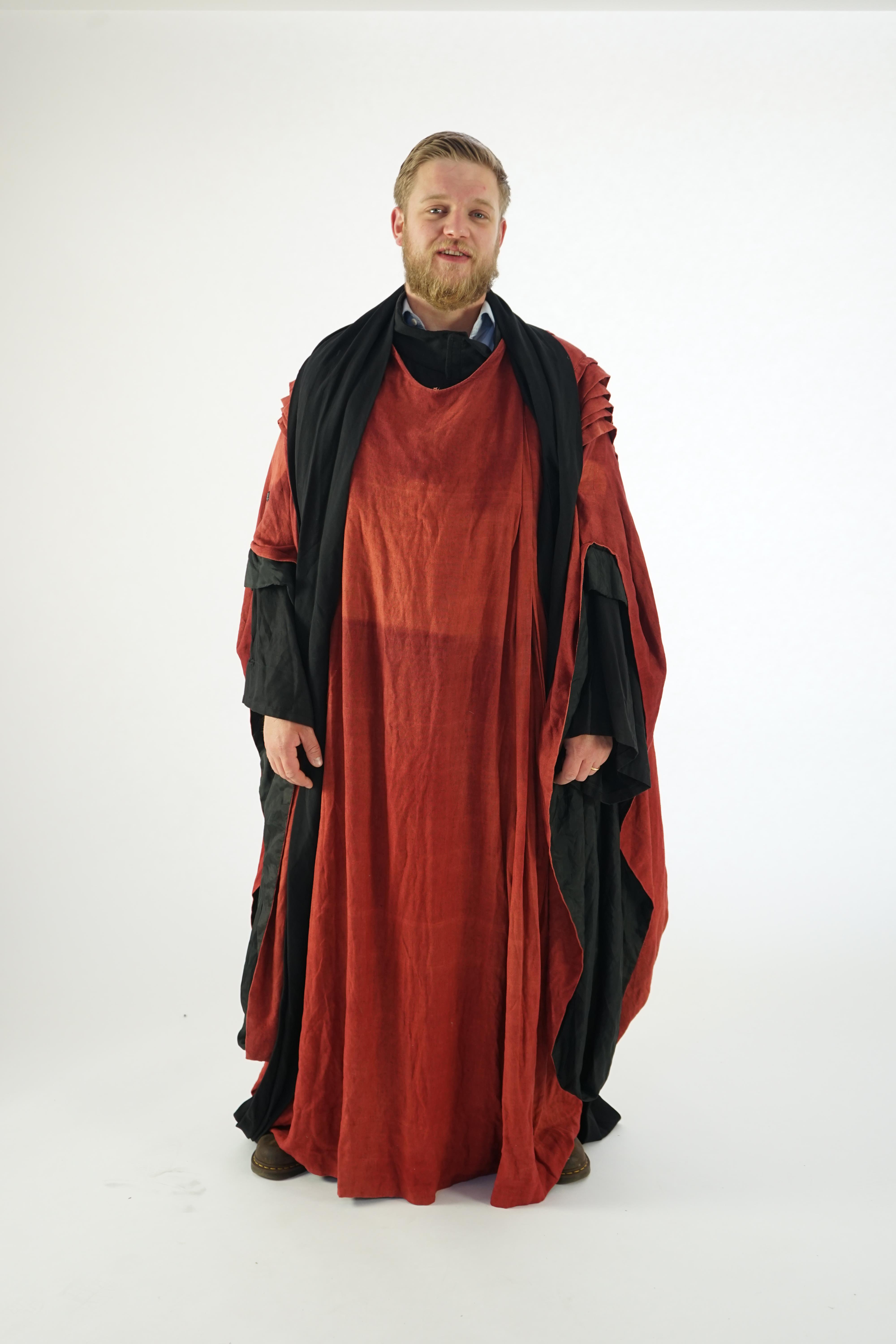A Priest's inner and outer robe and large belt (rust coloured and black). Ex Glyndebourne Festival Opera 'Idomeneo'